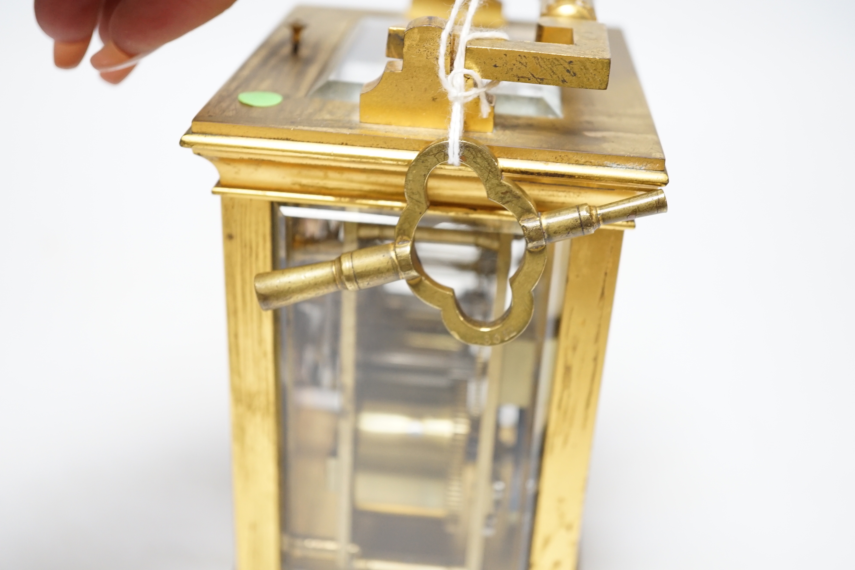 A late 19th century French gilt brass cased eight day repeating carriage clock with key, 17cm